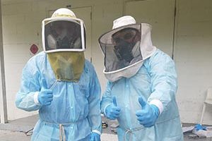 beekeepers in protective clothing